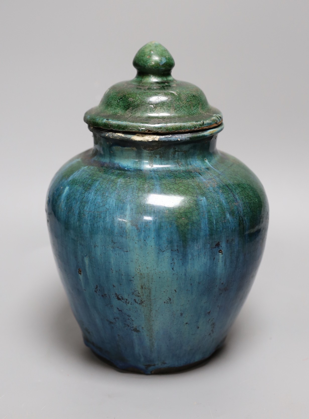 A Chinese mottle glazed terracotta jar and cover, 19th century, 24 cms high